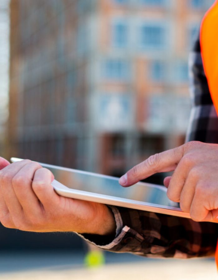 close-up-construction-engineer-using-tablet